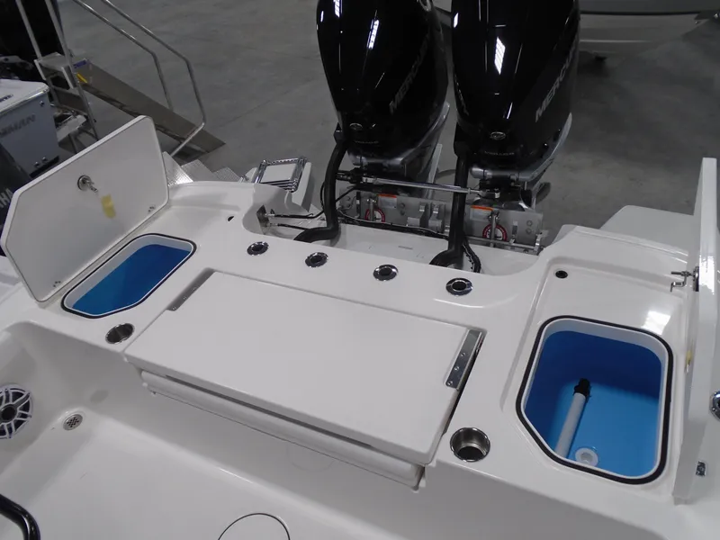 Slide: The Image of 2025 Caymas 281 HB boat deck with dual engines and storage compartments. - 28