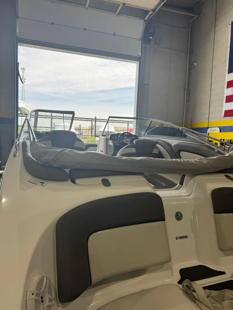 Slide: The Image of 2011 Yamaha Boats 242 Limited in a garage, showcasing sleek interior design. - 1