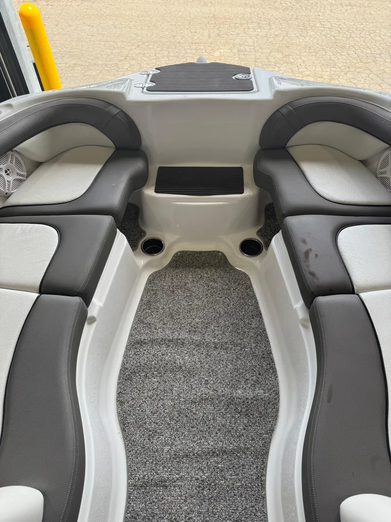 Slide: The Image of Interior view of 2011 Yamaha Boats 242 Limited, featuring cushioned seating and carpeted flooring. - 8