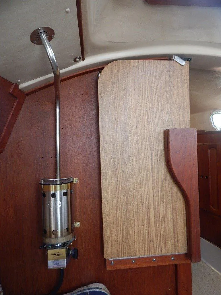Slide: The Image of Interior of 1983 Newport 28 Sloop showing wooden panel and metal fixture. - 23