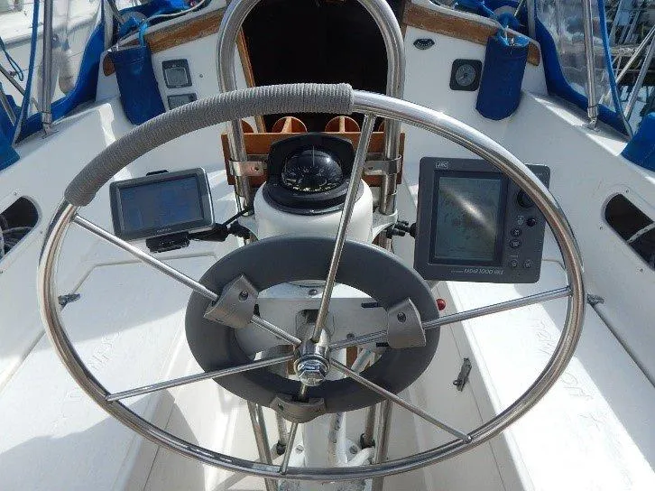 Slide: The Image of Cockpit of 1983 Newport 28 Sloop with steering wheel and navigation instruments. - 6