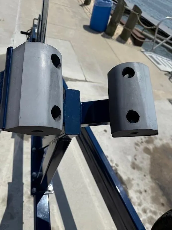 Slide: The Image of 2014 Cobalt boat trailer component near waterfront dock. - 8