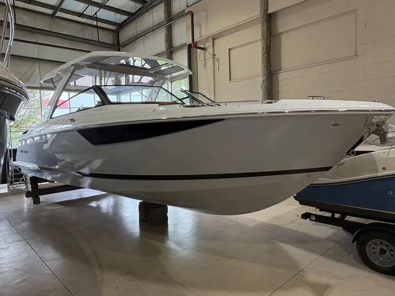 The Image of 2025 Cobalt R35 boat in a showroom, showcasing sleek design and modern features. - 0