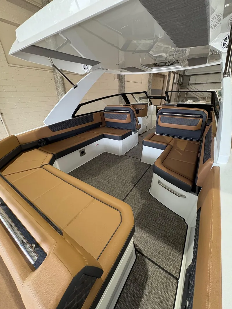 Slide: The Image of 2025 Cobalt R35 boat interior with luxurious tan seating and modern design. - 3