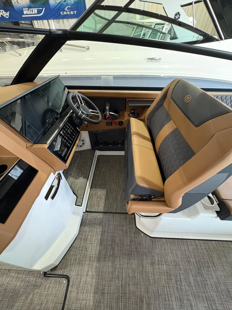Slide: The Image of 2025 Cobalt R35 boat interior with modern dashboard and luxurious seating. - 5