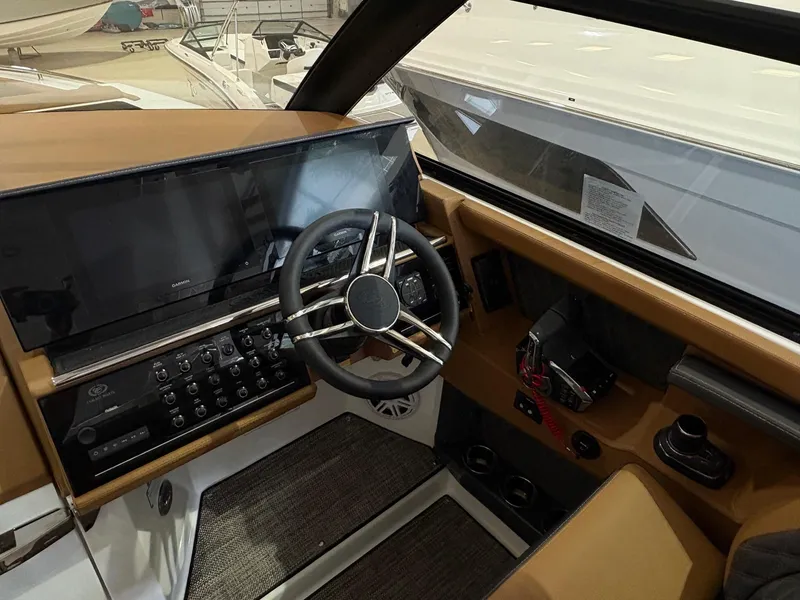 Slide: The Image of Interior view of 2025 Cobalt R35 boat cockpit with modern steering and controls. - 6