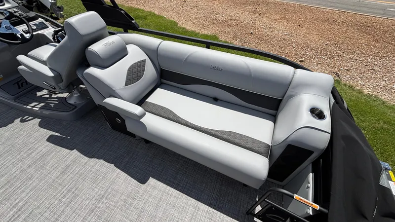 Slide: The Image of Luxurious seating on 2025 JC Neptoon 25TT Sport pontoon boat, featuring sleek gray upholstery. - 13