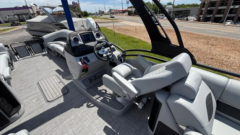 Slide: The Image of 2025 JC Neptoon 25TT Sport boat interior with modern helm and seating. - 14