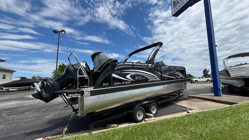 Slide: The Image of 2025 JC Neptoon 25TT Sport boat on trailer under cloudy sky. - 3