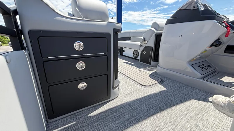 Slide: The Image of 2025 JC Neptoon 25TT Sport interior with sleek storage drawers and modern seating. - 31