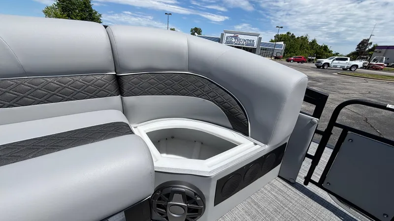 Slide: The Image of 2025 JC Neptoon 25TT Sport pontoon boat with gray seating and built-in storage. - 37
