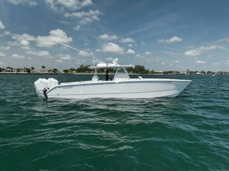 The Image of 2018 Invincible 40 Catamaran on calm waters under a clear sky. - 1