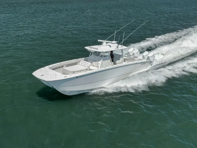 Slide: The Image of 2018 Invincible 40 Catamaran cruising on open water, showcasing sleek design and powerful performance. - 10