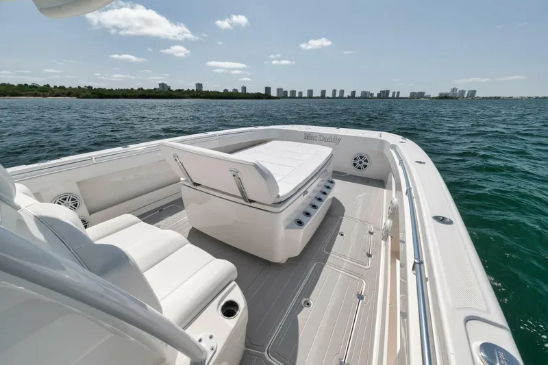 Slide: The Image of 2018 Invincible 40 Catamaran on water, featuring spacious seating and ocean view. - 17