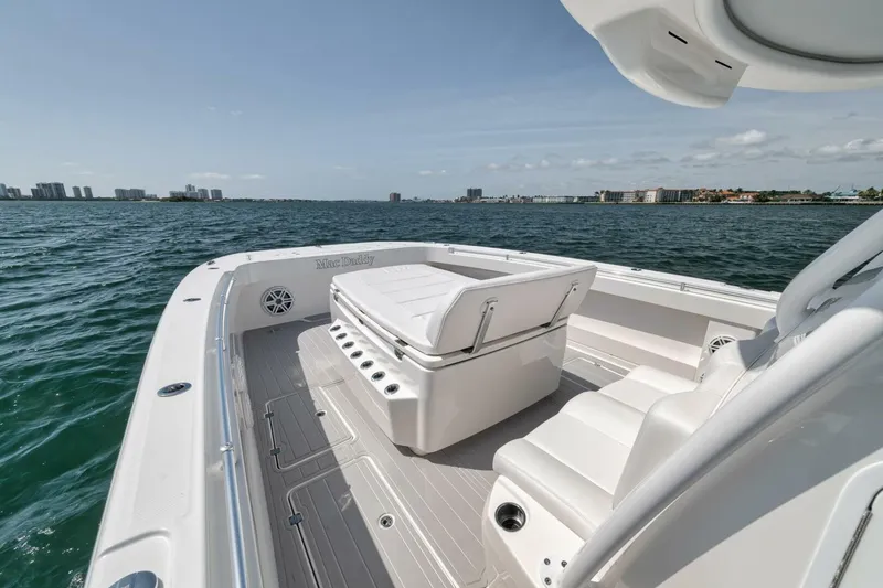 Slide: The Image of 2018 Invincible 40 Catamaran on open water, showcasing spacious deck and seating. - 19