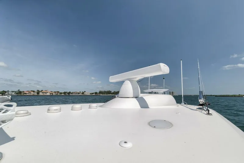 Slide: The Image of 2018 Invincible 40 Catamaran radar system on deck, with ocean and clear sky background. - 22