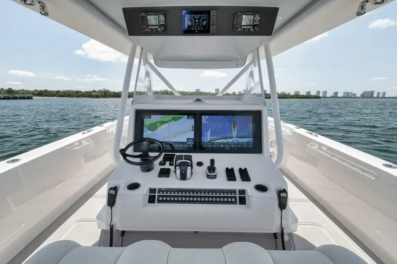Slide: The Image of Cockpit of 2018 Invincible 40 Catamaran with advanced navigation systems and dual screens. - 28