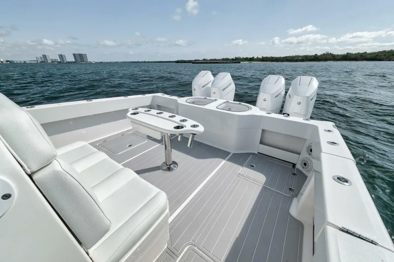 Slide: The Image of 2018 Invincible 40 Catamaran with quad engines, spacious deck, and seating on open water. - 34