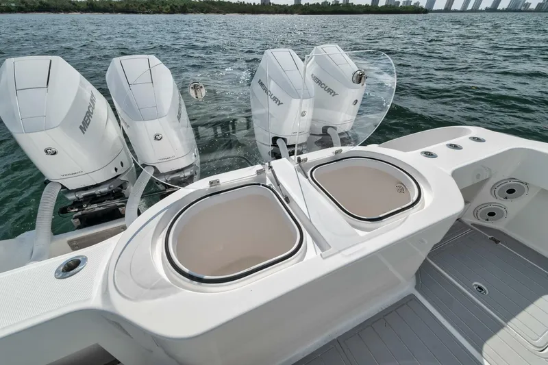 Slide: The Image of 2018 Invincible 40 Catamaran with four Mercury outboard engines on open water. - 41
