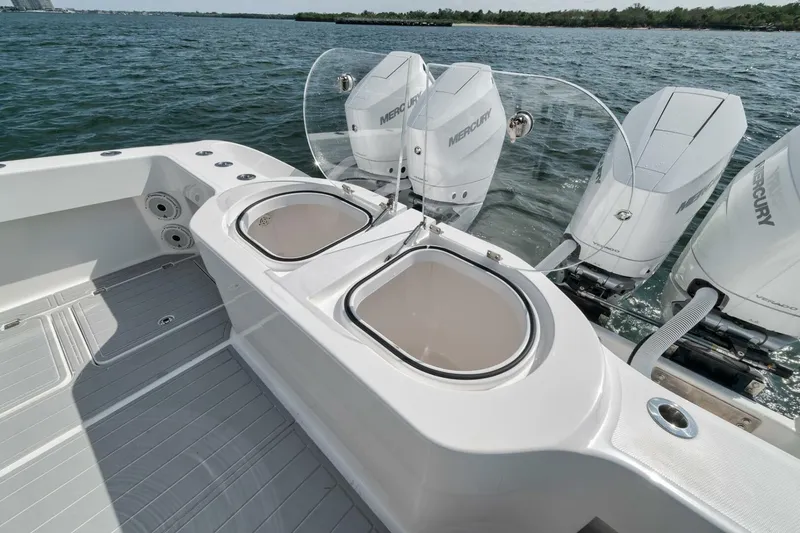 Slide: The Image of 2018 Invincible 40 Catamaran with dual outboard engines and sleek deck design. - 42