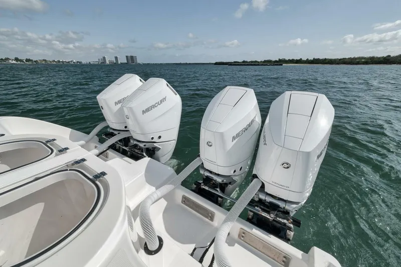 Slide: The Image of Four Mercury outboard engines on a 2018 Invincible 40 Catamaran in open water. - 45