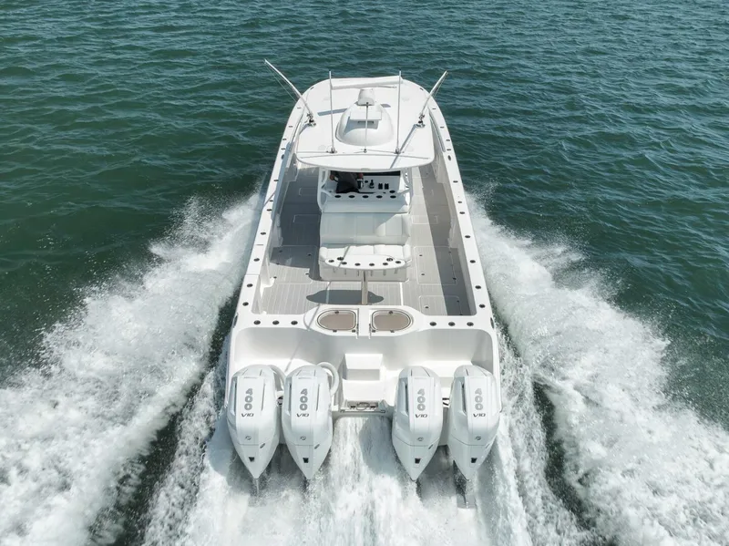 Slide: The Image of Invincible 40 Catamaran 2018 cruising on water, rear view with powerful engines. - 49