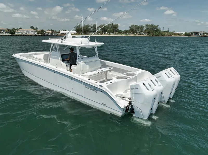 Slide: The Image of 2018 Invincible 40 Catamaran on water, featuring triple outboard engines. - 5