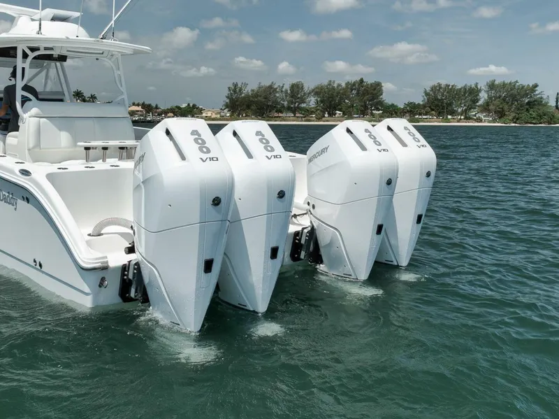 Slide: The Image of 2018 Invincible 40 Catamaran with four powerful outboard engines on a sunny day. - 6