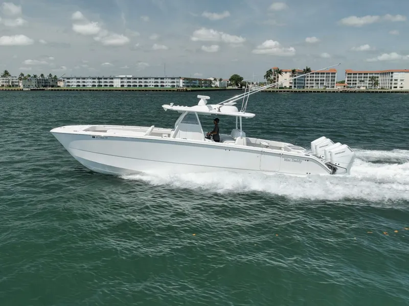 Slide: The Image of 2018 Invincible 40 Catamaran cruising on water, showcasing sleek design and powerful performance. - 9