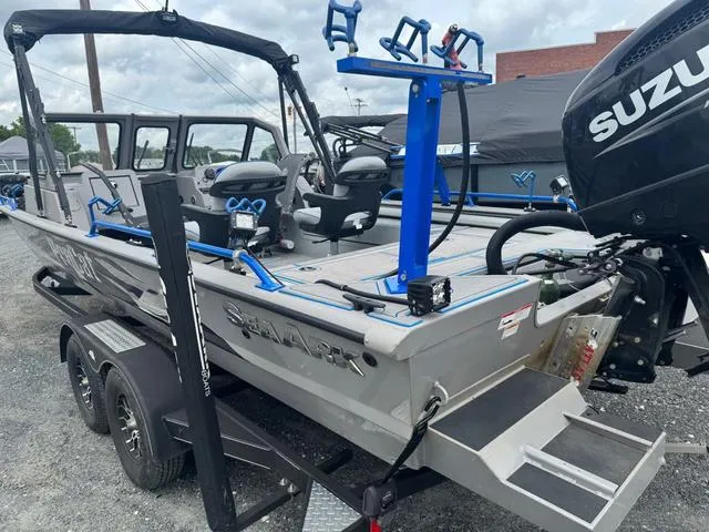 Slide: The Image of 2023 SeaArk Pro Cat 240 boat with Suzuki engine, equipped for fishing. - 12