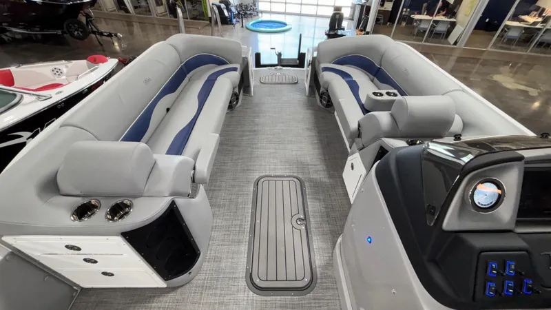 Slide: The Image of 2025 JC Neptoon 25TT Sport pontoon boat interior with modern seating and control panel. - 13
