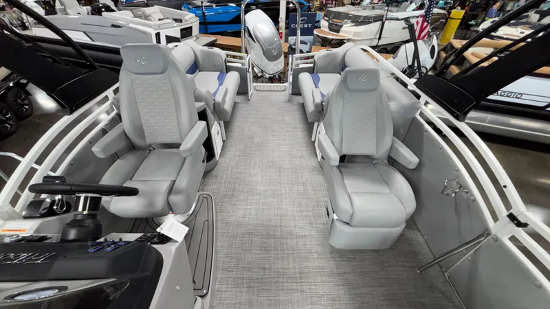 Slide: The Image of 2025 JC Neptoon 25TT Sport pontoon boat interior with gray seating and modern design. - 14