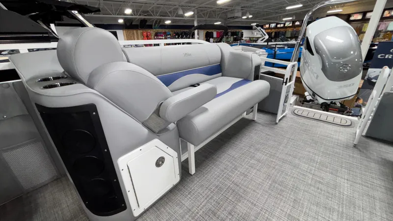 Slide: The Image of 2025 JC Neptoon 25TT Sport pontoon boat interior with gray seating and modern design. - 15