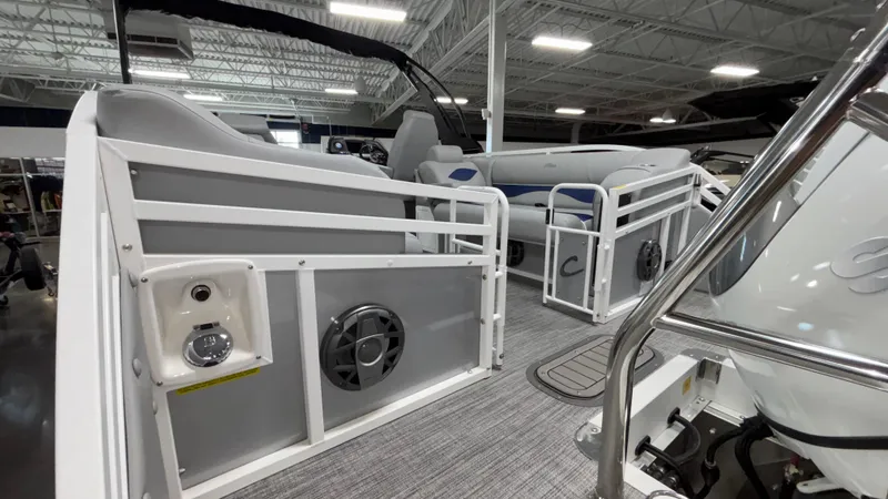 Slide: The Image of 2025 JC Neptoon 25TT Sport pontoon boat interior with modern seating and audio system. - 18
