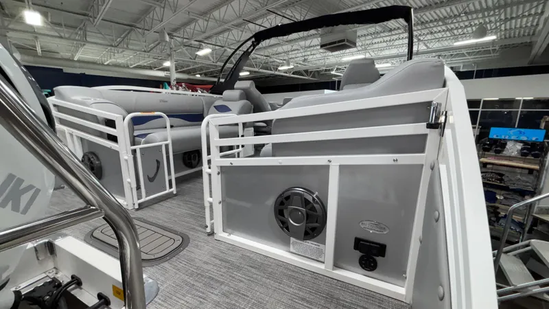 Slide: The Image of 2025 JC Neptoon 25TT Sport pontoon boat interior with modern seating and audio system. - 19