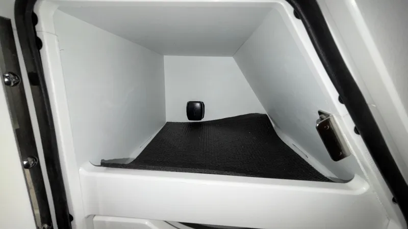 Slide: The Image of Storage compartment of 2025 JC Neptoon 25TT Sport boat, featuring a sleek interior design. - 24