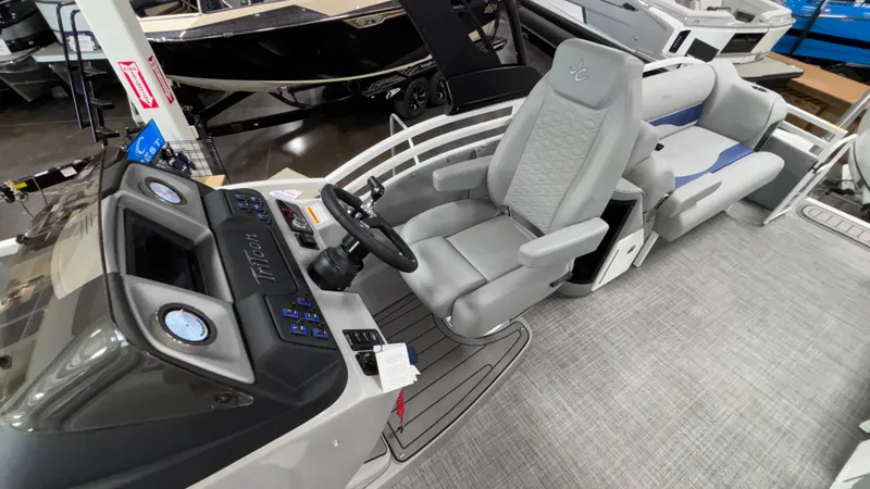 Slide: The Image of 2025 JC Neptoon 25TT Sport boat interior with modern helm and seating. - 27