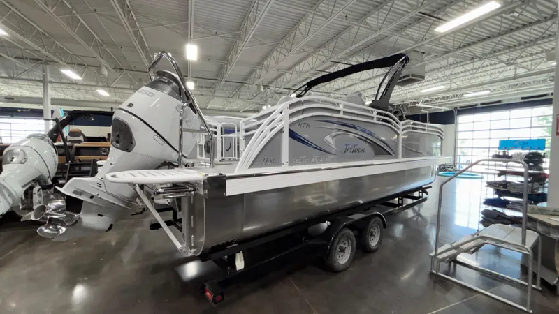 Slide: The Image of 2025 JC Neptoon 25TT Sport pontoon boat on trailer in showroom. - 3