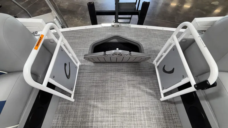 Slide: The Image of Interior view of 2025 JC Neptoon 25TT Sport boat with open storage compartment. - 32
