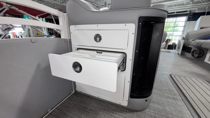 Slide: The Image of Interior of 2025 JC Neptoon 25TT Sport boat with open storage compartment. - 34