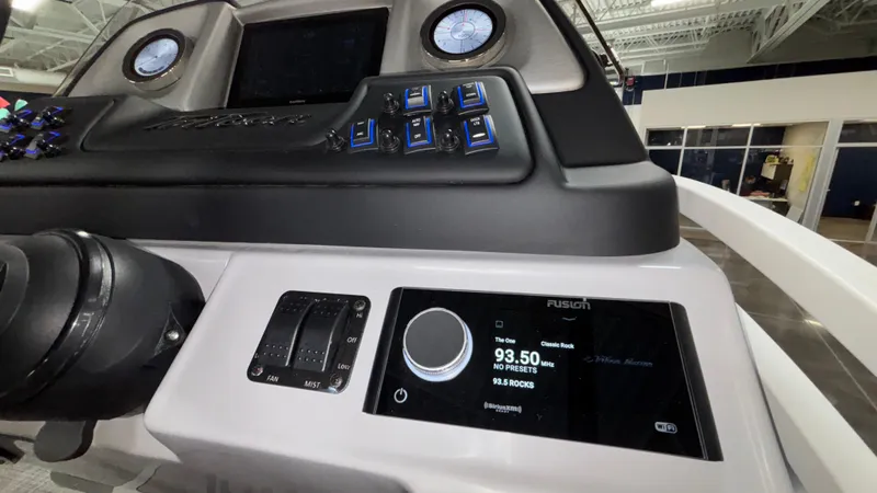 Slide: The Image of Control panel of 2025 JC Neptoon 25TT Sport boat with digital display and controls. - 38