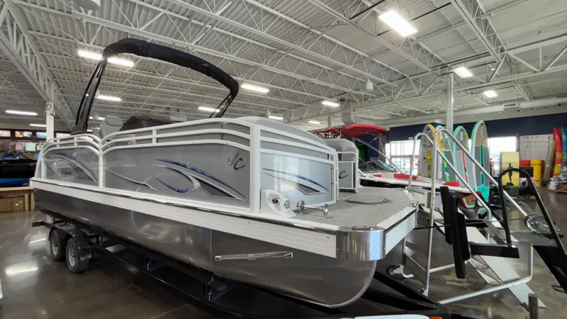 Slide: The Image of 2025 JC Neptoon 25TT Sport pontoon boat displayed indoors. - 4