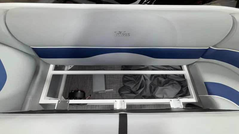 Slide: The Image of Interior seating of 2025 JC Neptoon 25TT Sport boat, featuring storage compartment. - 43