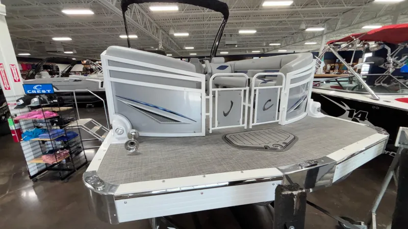 Slide: The Image of 2025 JC Neptoon 25TT Sport pontoon boat displayed in a showroom. - 49