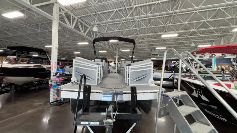 Slide: The Image of 2025 JC Neptoon 25TT Sport pontoon boat displayed in a showroom. - 5