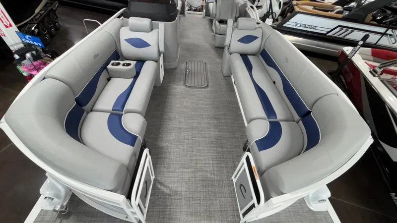 Slide: The Image of 2025 JC Neptoon 25TT Sport pontoon boat interior with gray and blue seating. - 6