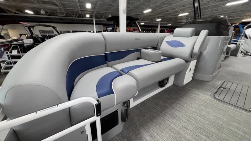 Slide: The Image of 2025 JC Neptoon 25TT Sport pontoon boat with luxurious gray and blue seating. - 8