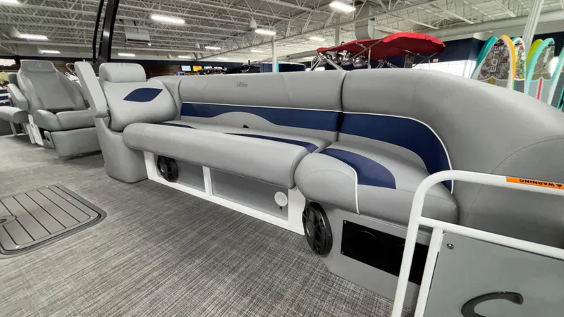 Slide: The Image of 2025 JC Neptoon 25TT Sport pontoon boat interior with gray and blue seating. - 9