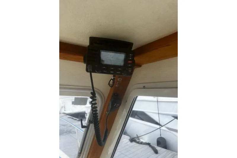 Slide: The Image of Interior view of a 2016 Eastern 27 Islander boat with mounted radio equipment. - 21