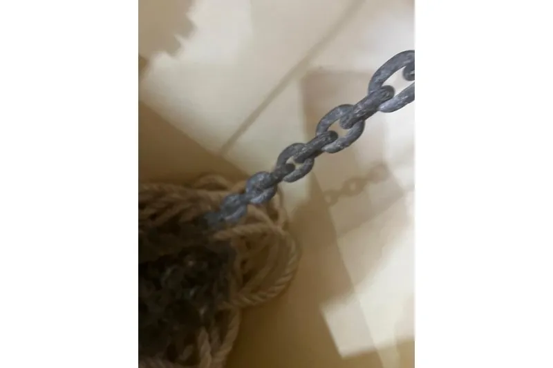 Slide: The Image of Close-up of a chain and rope on a 2016 Eastern 27 Islander boat. - 39